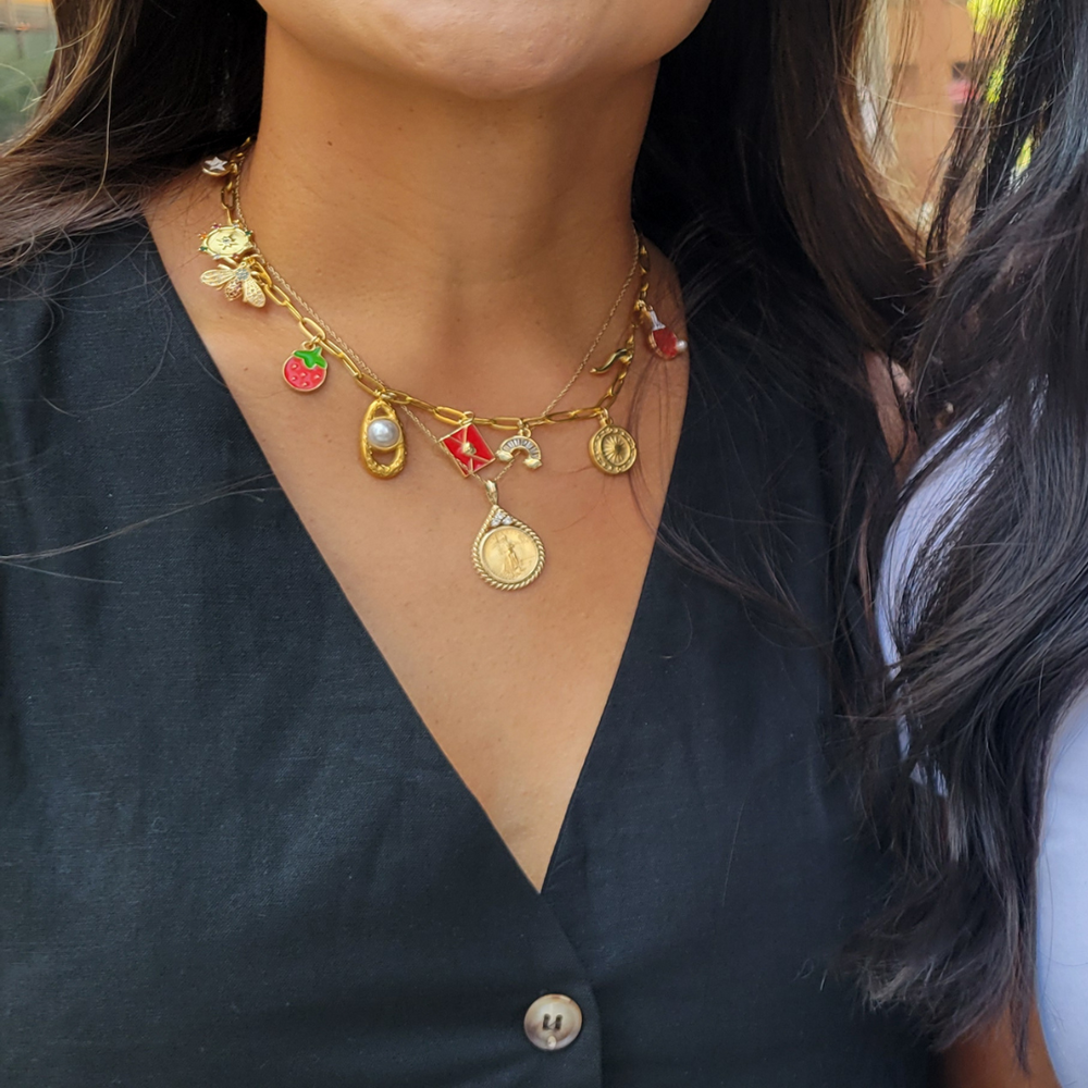 A Gilded Bond charm bar NYC permanent jewelry