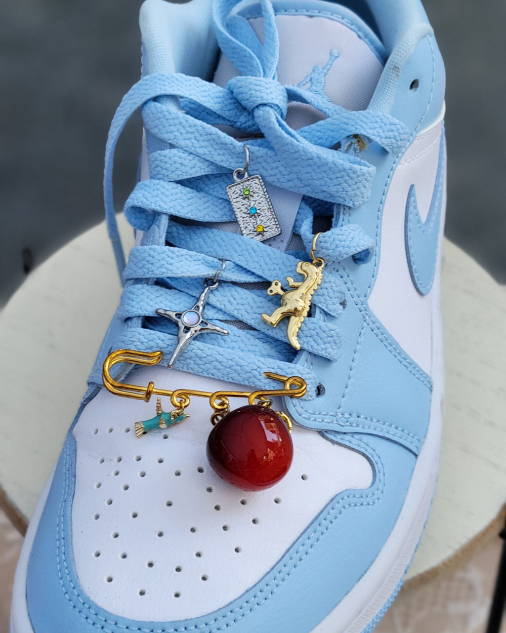 Sneaker charms from a charm bar in NYC, permanent jewelry NYC